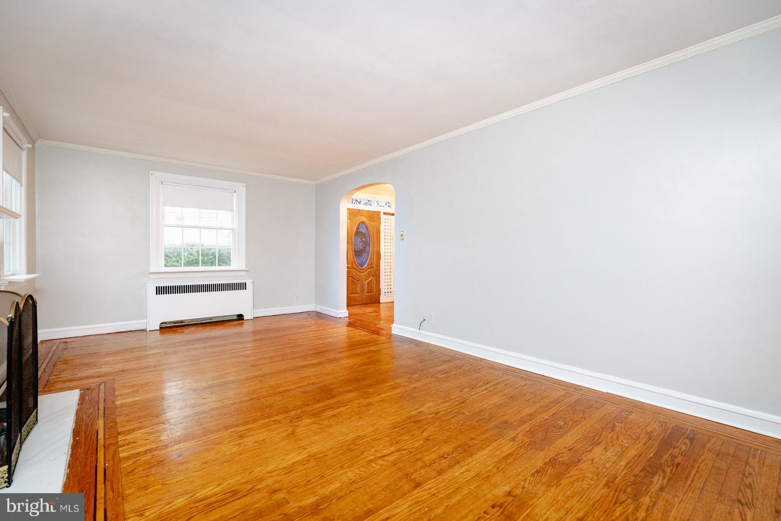 637 Croyden Road Cheltenham, PA 19012 - Photo 10 of 48 a view of an empty room with wooden floor and a window