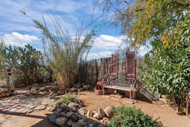 a backyard of a house with yard and outdoor seating