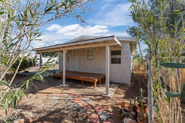 a view of a house with a flower garden