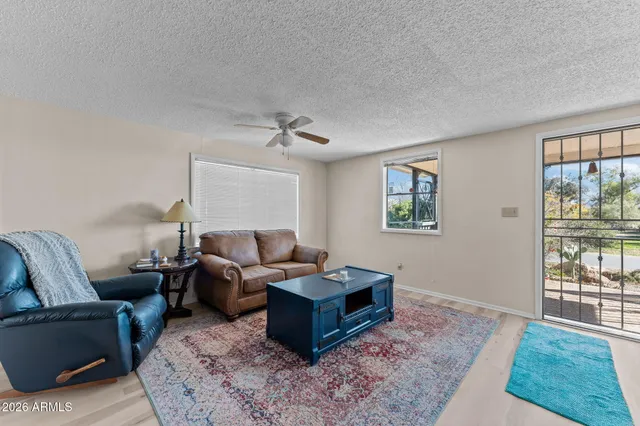 a living room with furniture and a rug