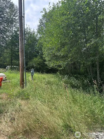 a view of outdoor space with deck and yard