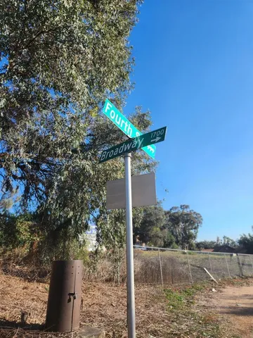 a lake view with a tree in the background