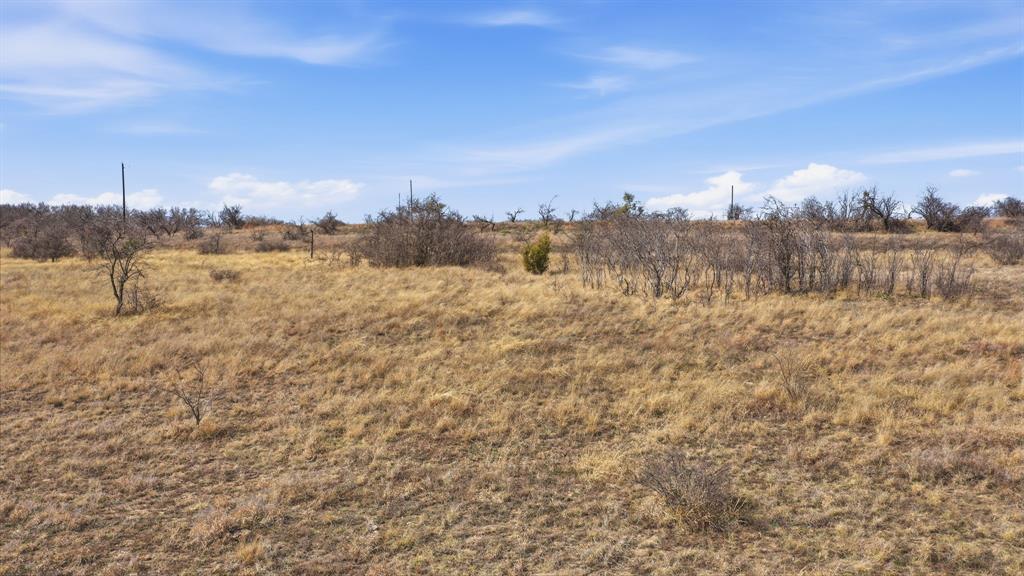 Lot 44 County Road 266 Gustine, TX 76455 - Photo 10 of 21 a view of a lake with houses in the back