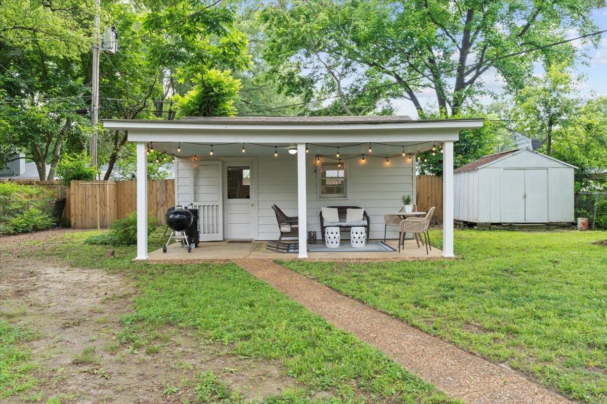 4491 Garnett Road Memphis, TN 38117 - Photo 22 of 32 a view of a house with backyard and porch