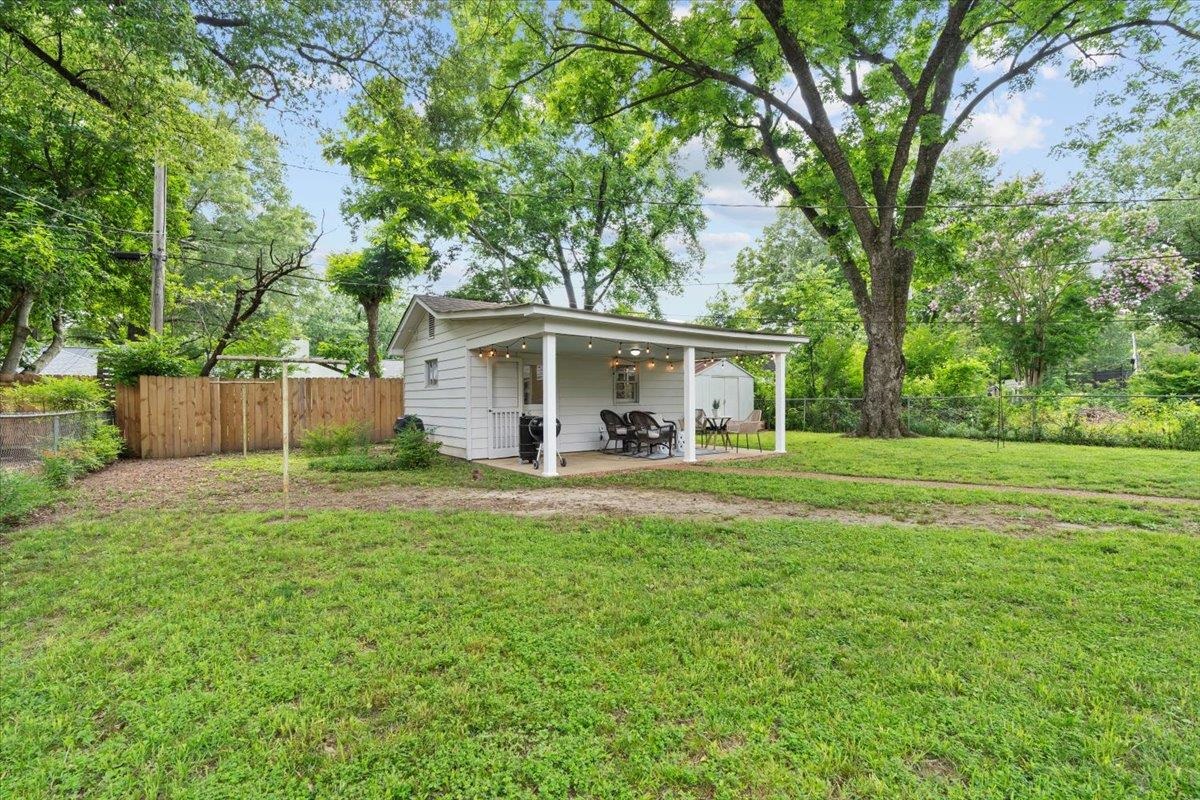 4491 Garnett Road Memphis, TN 38117 - Photo 23 of 32 a view of a house with a yard and a large tree