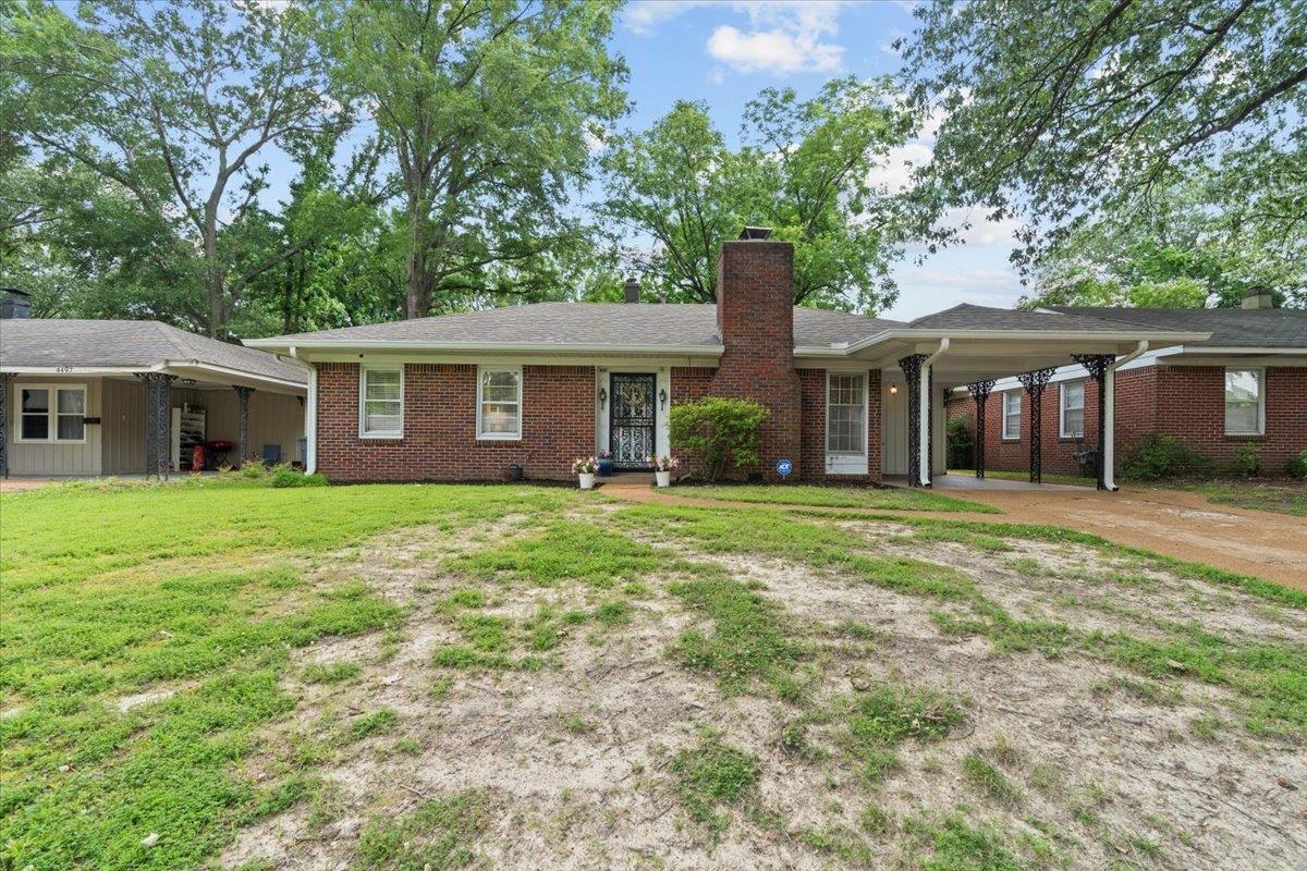 4491 Garnett Road Memphis, TN 38117 - Photo 25 of 32 a front view of a house with a garden