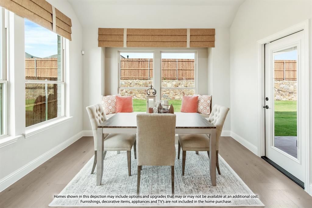 5610 Rutherford Drive Midlothian, TX 76065 - Photo 13 of 26 a dining room with furniture and wooden floor