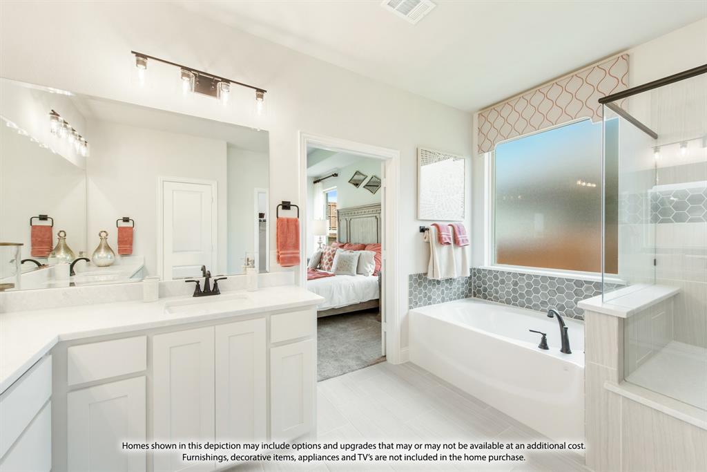 5610 Rutherford Drive Midlothian, TX 76065 - Photo 24 of 26 a en suite bathroom with a tub double sink window and mirror