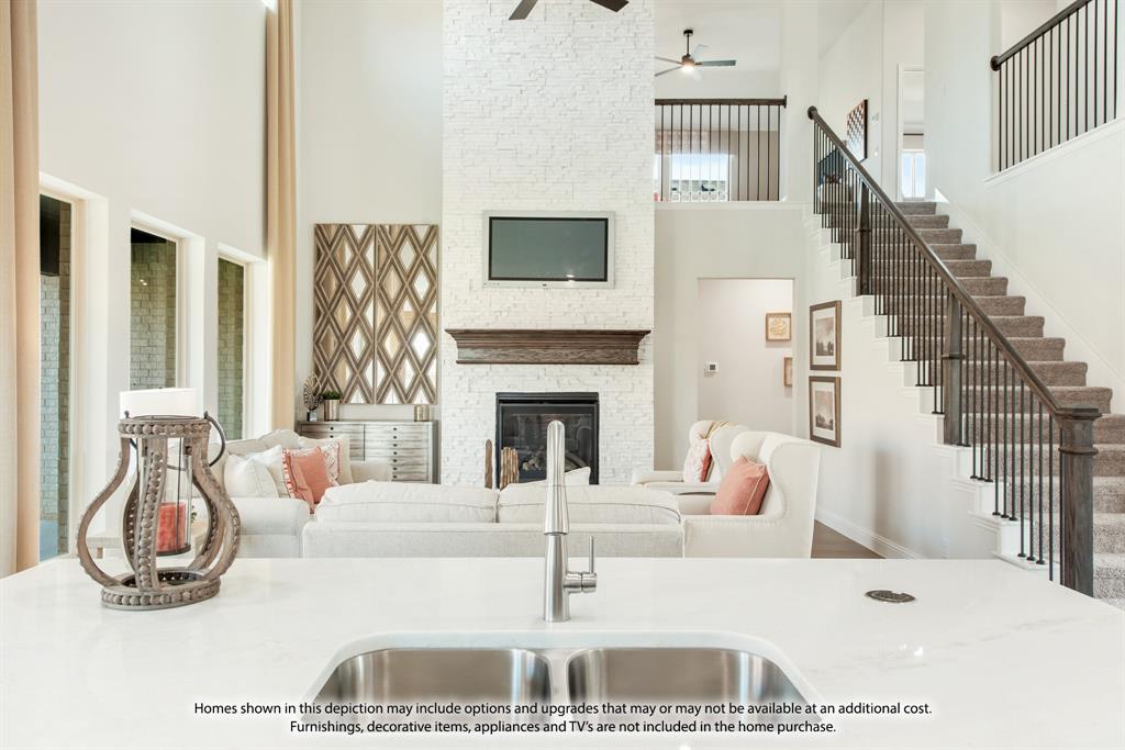 5610 Rutherford Drive Midlothian, TX 76065 - Photo 8 of 26 a living room with furniture and a fireplace