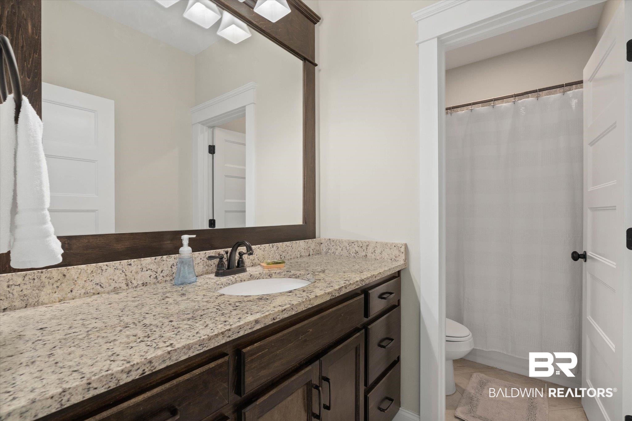 24821 Austin Road Daphne, AL 36526 - Photo 16 of 24 Bathroom with vanity and tile patterned floors