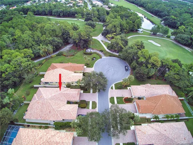 an aerial view of house with yard swimming pool and outdoor seating
