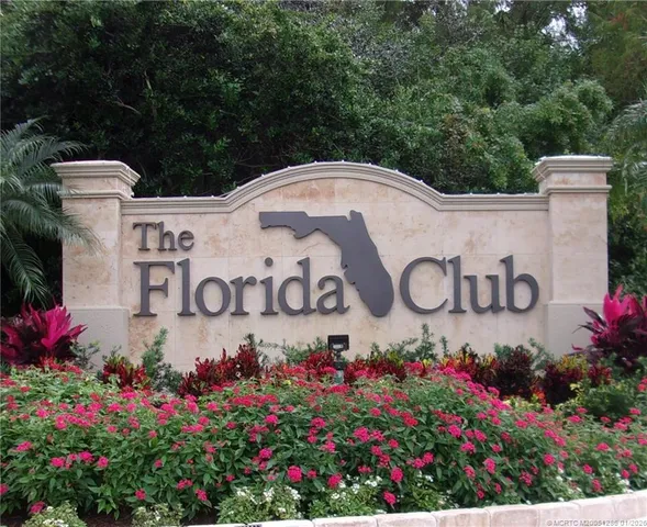 a garden with trees in the background