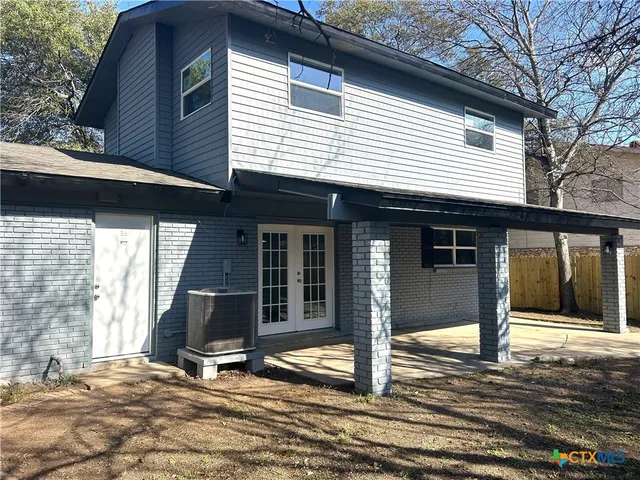 a house with trees in front of it