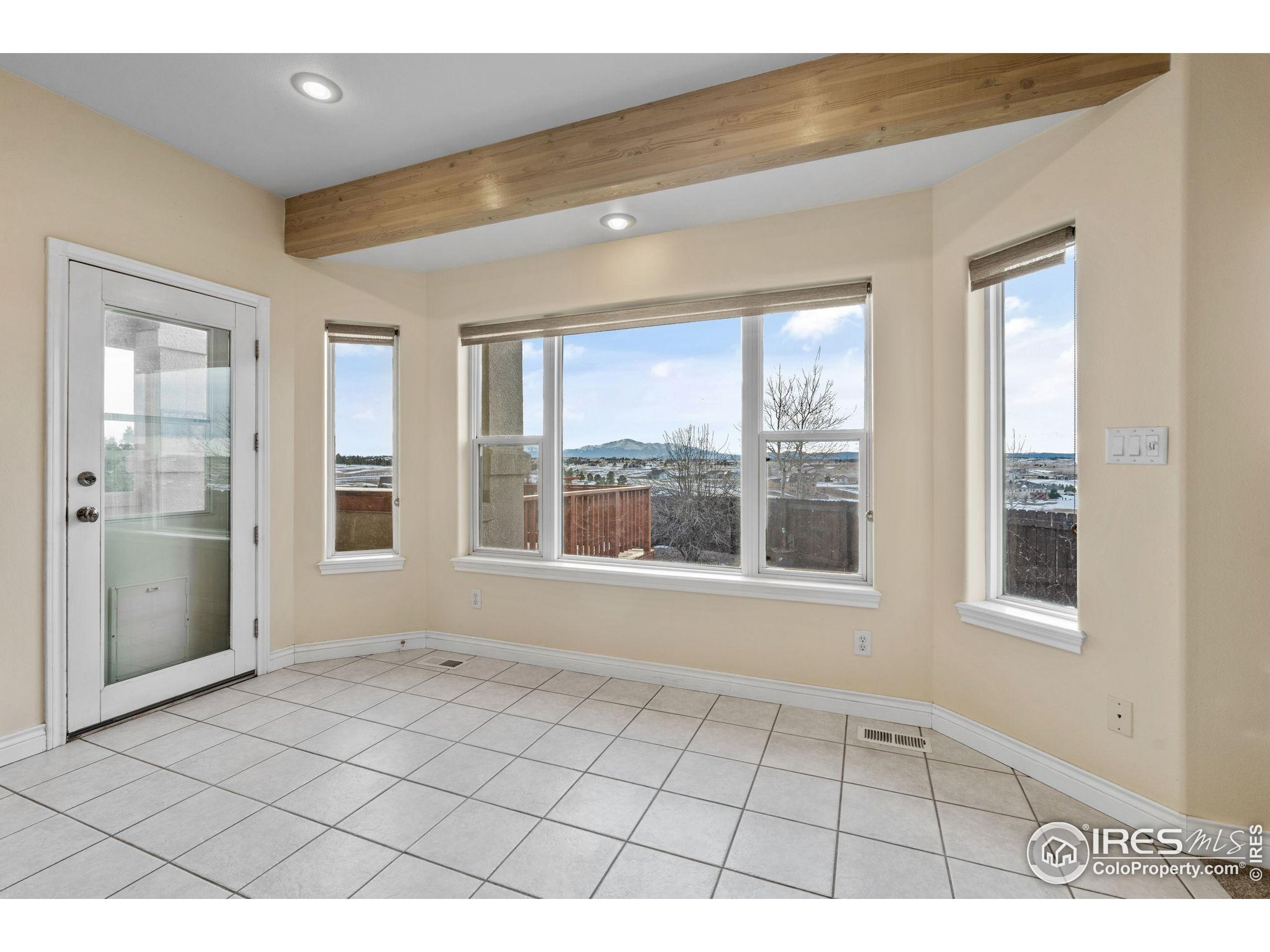 17035 Herring Road Colorado Springs, CO 80908 - Photo 18 of 38 a view of an empty room and window