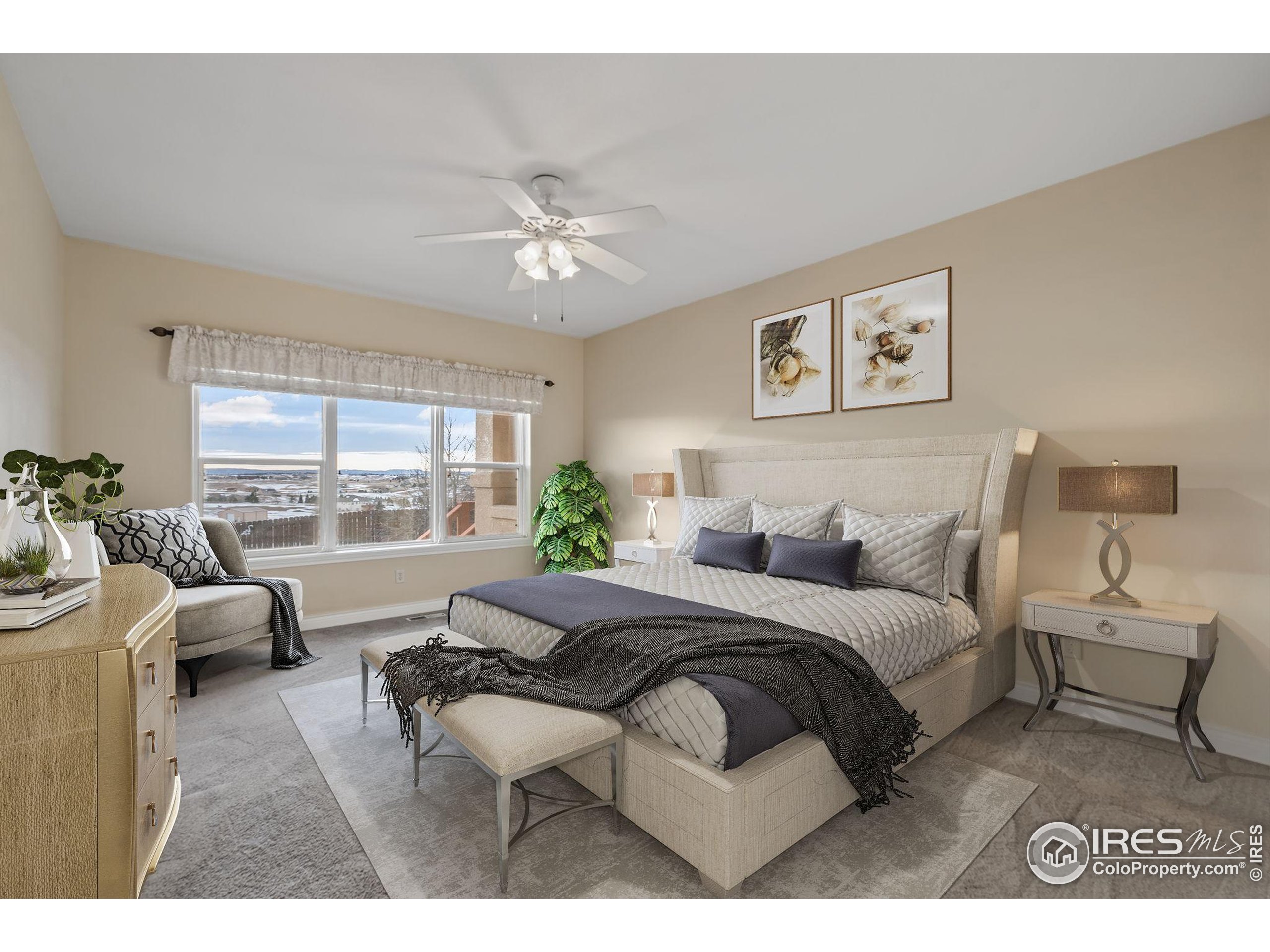 17035 Herring Road Colorado Springs, CO 80908 - Photo 23 of 38 a spacious bedroom with a bed a couch and a large window