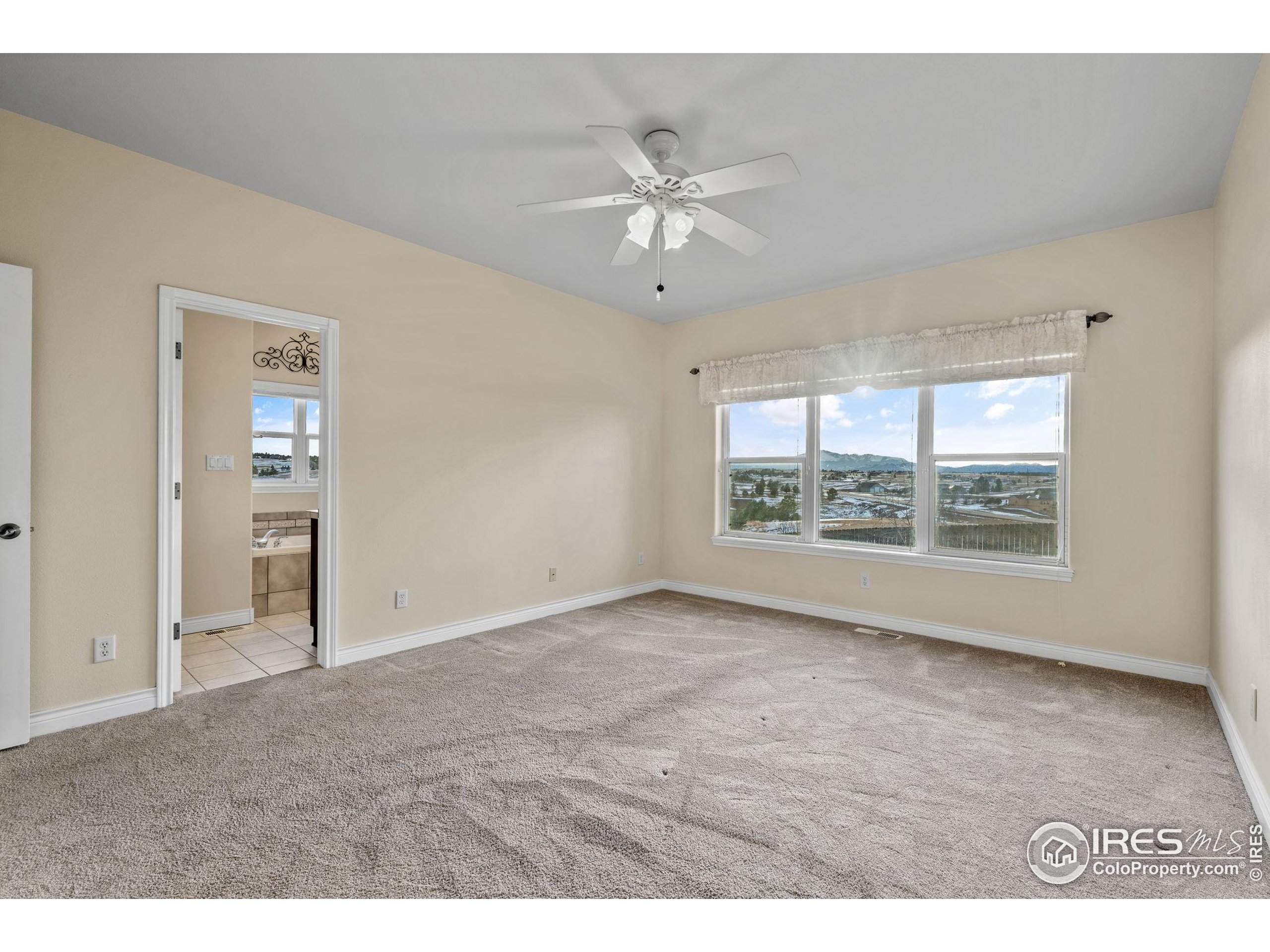 17035 Herring Road Colorado Springs, CO 80908 - Photo 24 of 38 a view of an empty room with a window