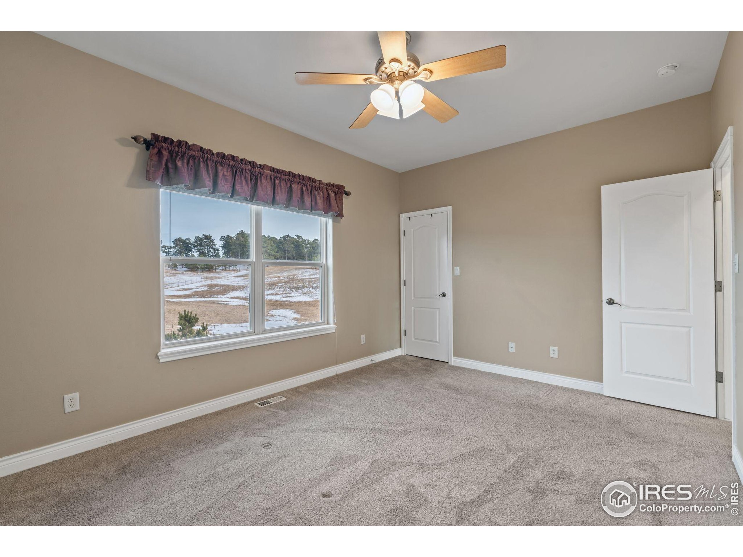17035 Herring Road Colorado Springs, CO 80908 - Photo 26 of 38 a view of an empty room with a window
