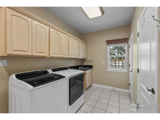 a kitchen with a stove a sink and cabinets