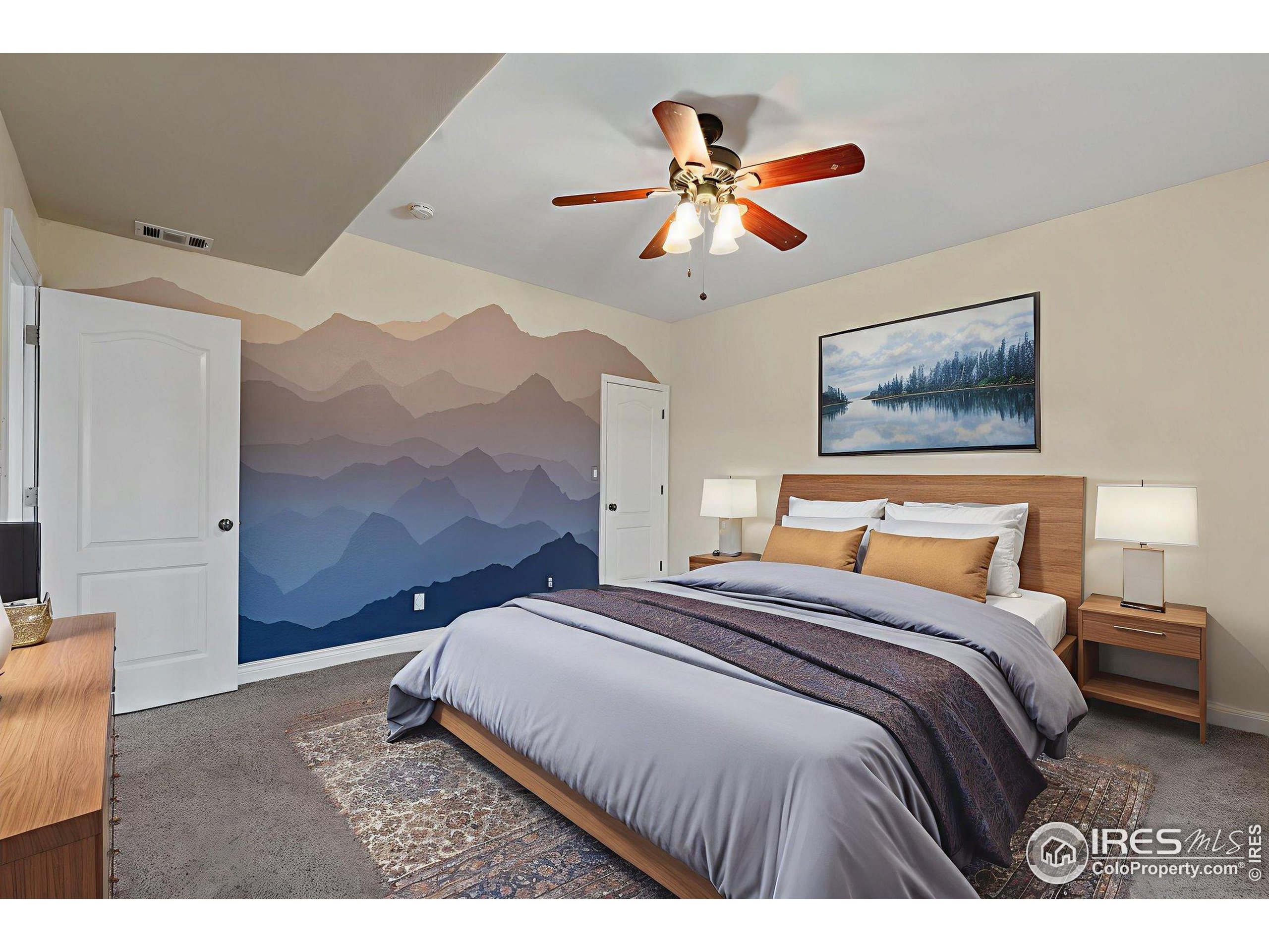 17035 Herring Road Colorado Springs, CO 80908 - Photo 35 of 38 a bedroom with a bed and a painting on the wall