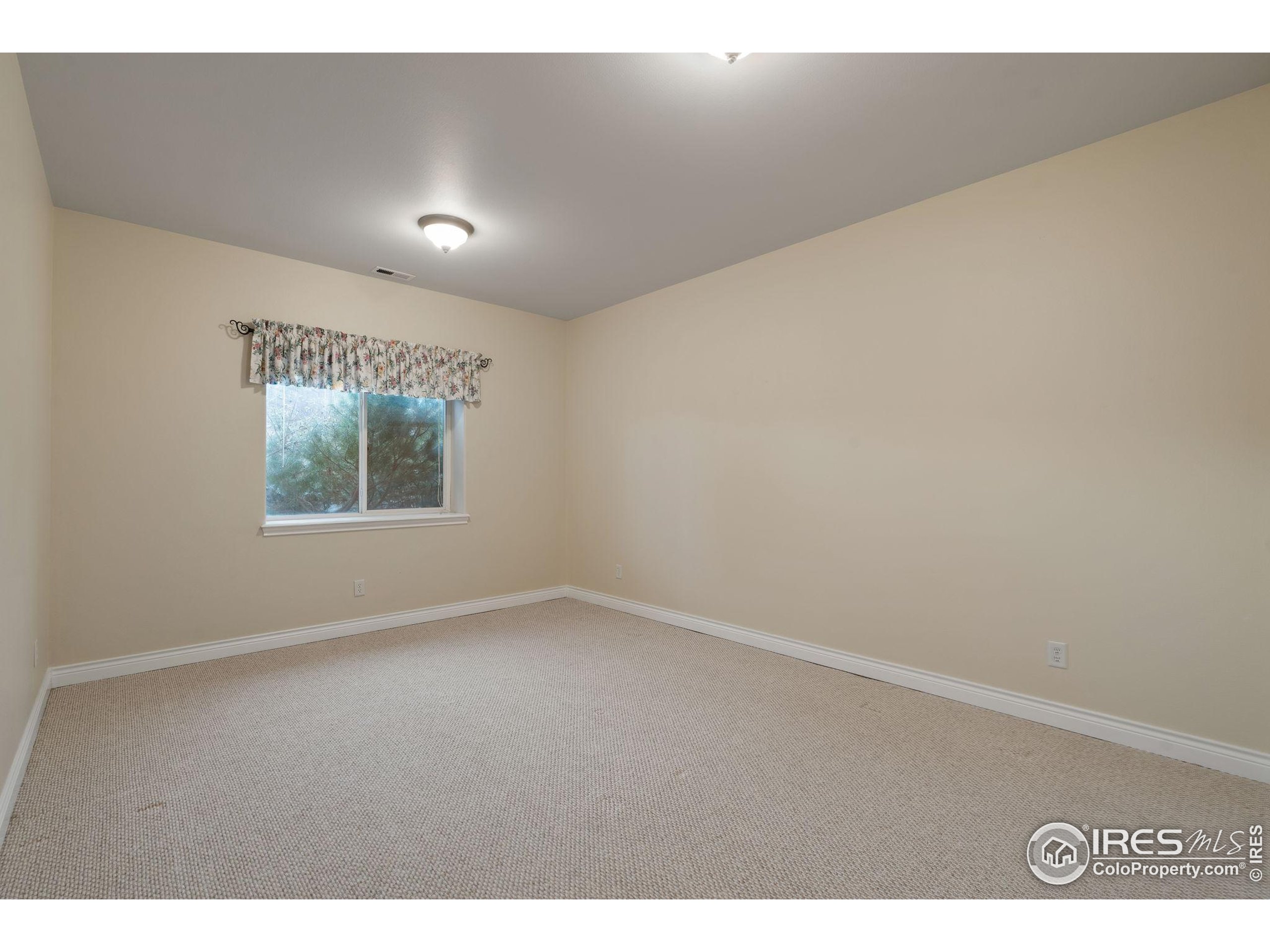 17035 Herring Road Colorado Springs, CO 80908 - Photo 36 of 38 a view of an empty room with a window