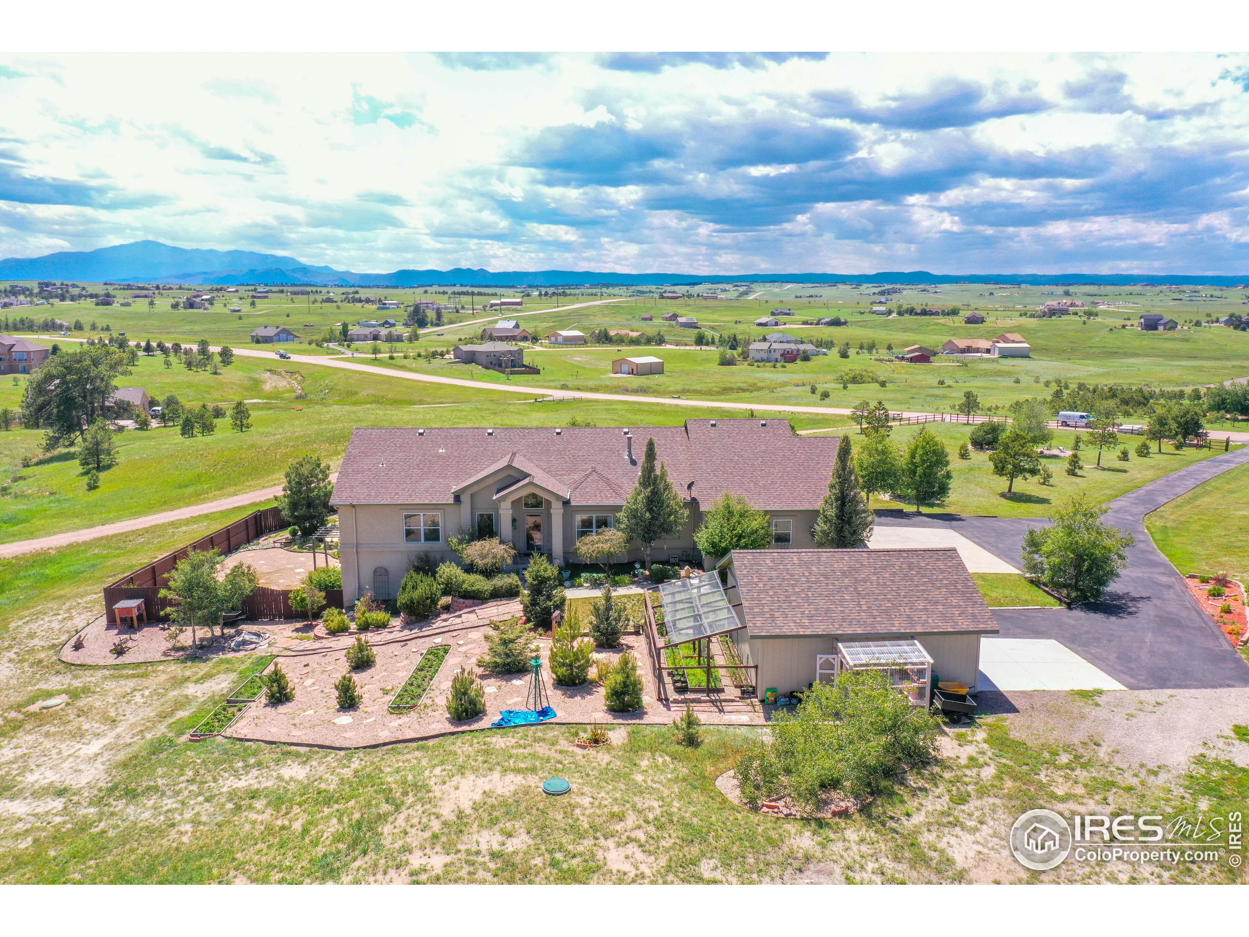 17035 Herring Road Colorado Springs, CO 80908 - Photo 4 of 38 an aerial view of residential houses with outdoor space and ocean view