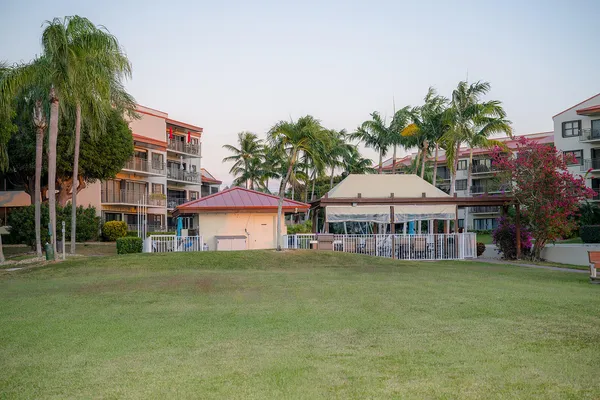 a front view of a building with garden