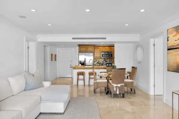 a kitchen with stainless steel appliances granite countertop a refrigerator and a sink