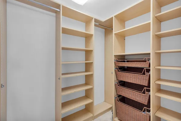 a bathroom with a double vanity sink toilet mirror and shower