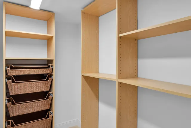 a view of a lake with a car parked in front of it