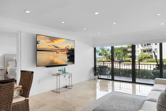 a view of a swimming pool with a garden and trees