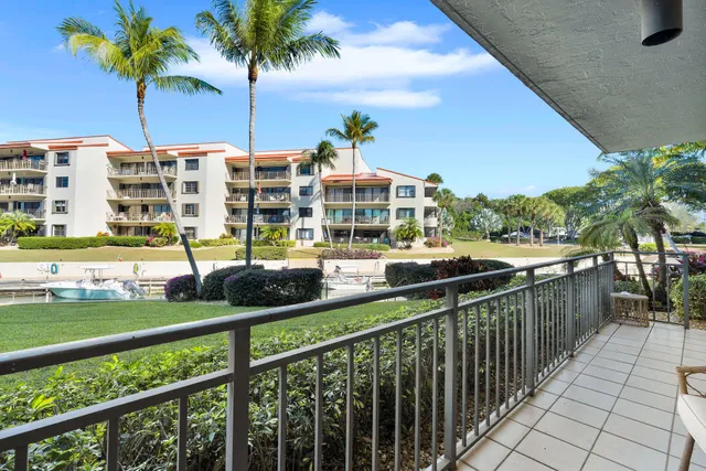 a view of a lake with houses in the back