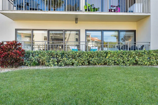 a view of a swimming pool with chairs