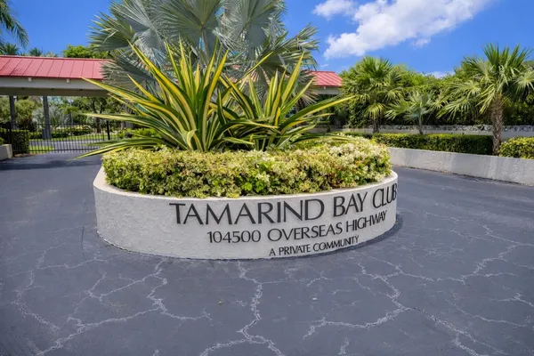 a bathroom with double vanity sinks and a mirror
