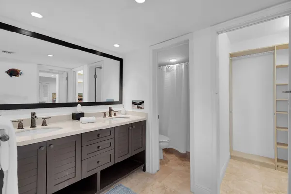 a view of building with yard and potted plants