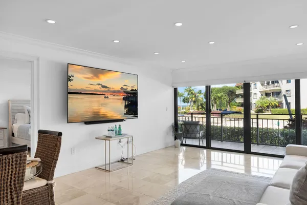 a swimming pool view with a outdoor seating