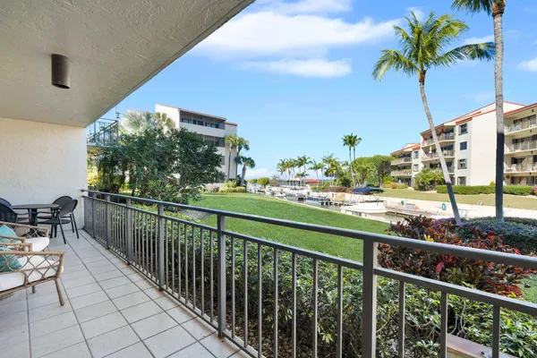 a view of swimming pool with outdoor seating and yard in back