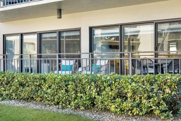 a swimming pool with outdoor seating and yard