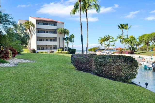 a kitchen with a sink appliances and cabinets
