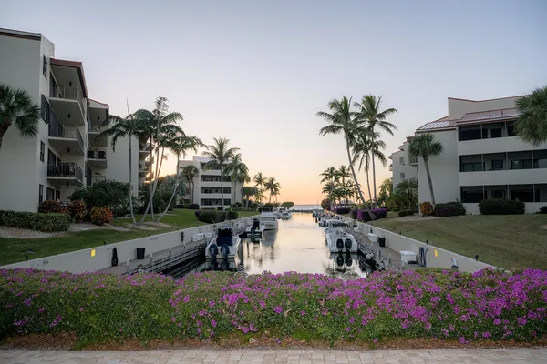 a large kitchen with stainless steel appliances granite countertop a lot of counter space and a sink
