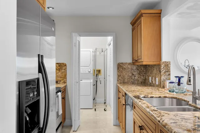 a living room with furniture a large window and a flat screen tv