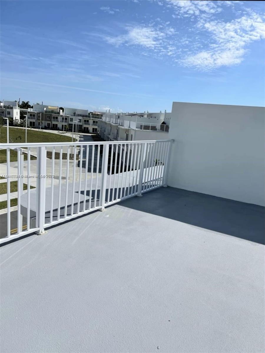 a view of a balcony with an outdoor space