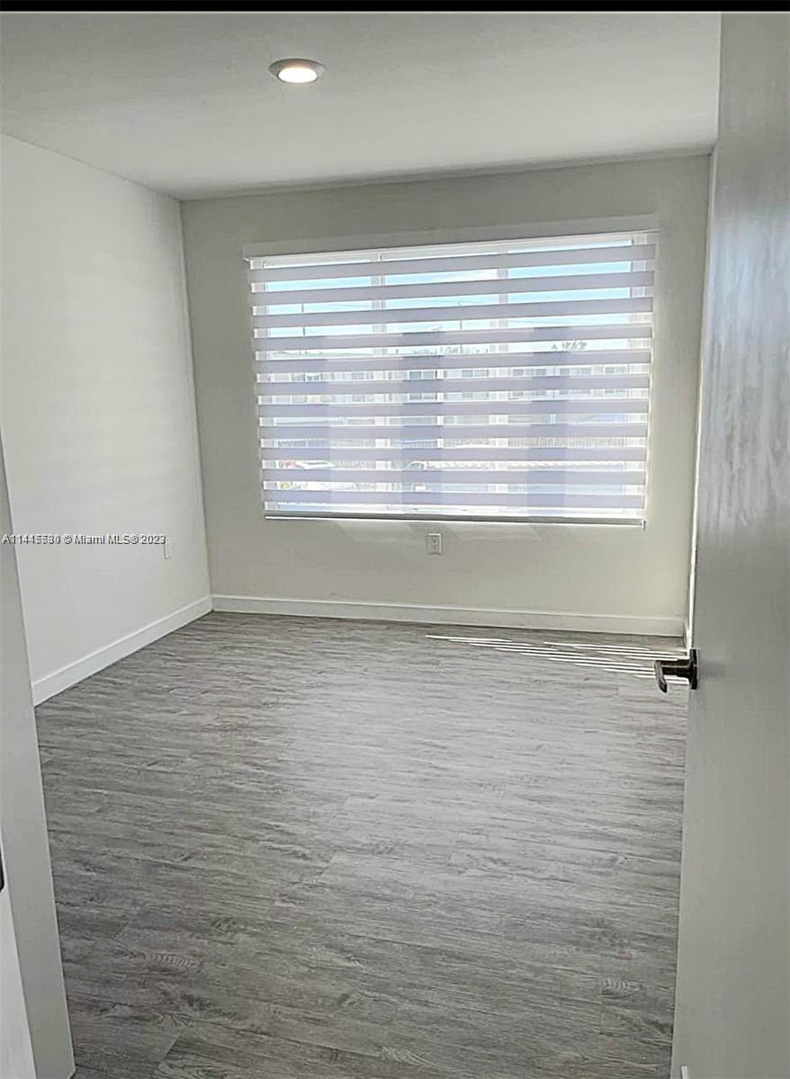 13966 Southwest 258th Street, Unit 13966 Homestead, FL 33032 - Photo 5 of 5 a bathroom with a window