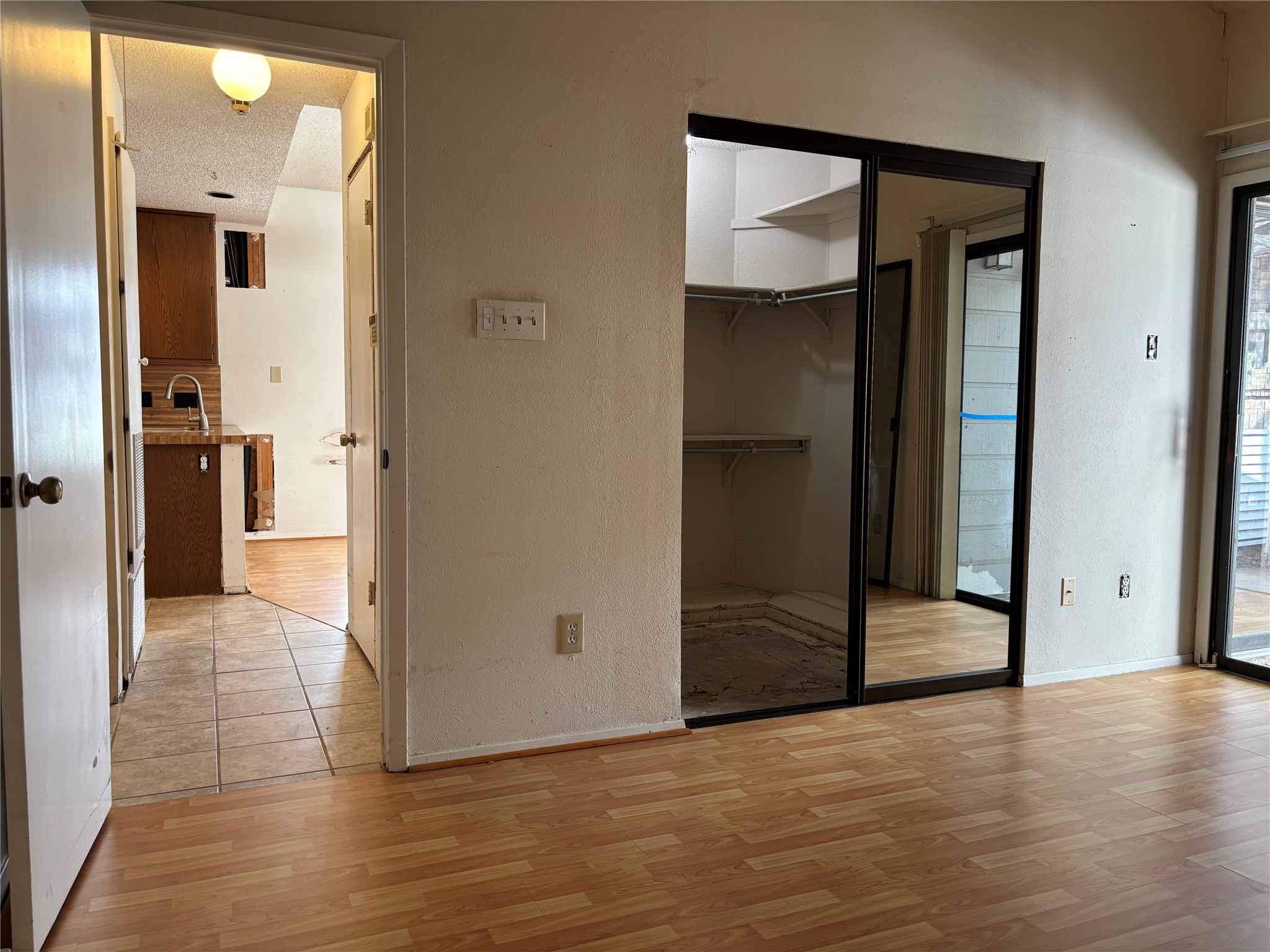 1748 Ohlen Road, Unit 9 Austin, TX 78757 - Photo 27 of 40 Bedroom with access to outside and main living area.