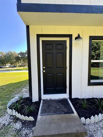 a view of a entryway door front of a house