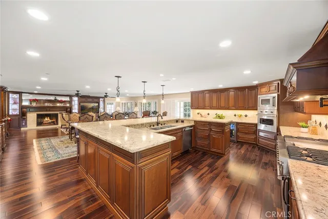 a bathroom with a double vanity sink toilet and shower
