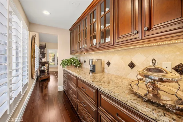 a living room with furniture a rug and a chandelier