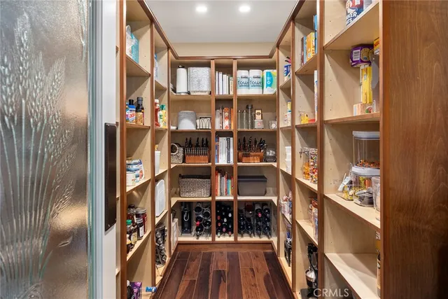 a living room with furniture a rug and a large window