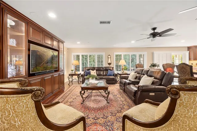 a spacious bathroom with a granite countertop sink and a mirror