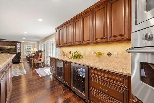 a kitchen with granite countertop a sink and stove top oven