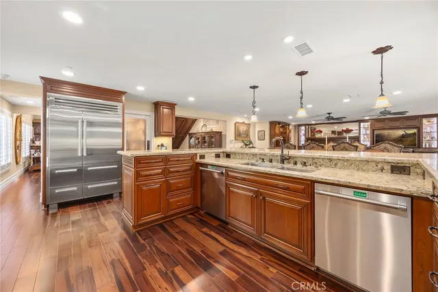 a living room with furniture a fireplace and a table